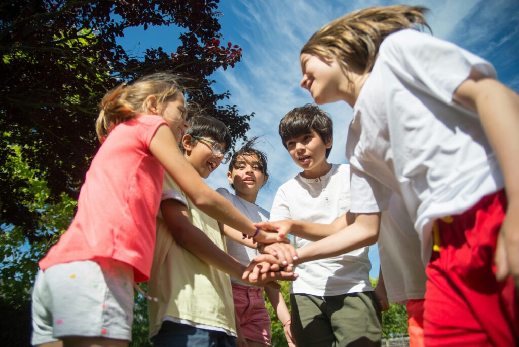 A group of kids enjoying a sunny day outdoors, capturing the joy and friendship of childhood.